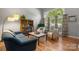 Inviting living room with ample natural light, hardwood floors, and comfortable seating at 9002 Maple Hill Ct, Huntersville, NC 28078