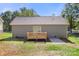 Exterior view of the home featuring a wood deck and neutral siding, set in a green lawn at 951 Hardin Dr, Shelby, NC 28150