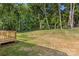 Expansive backyard with a partial view of the deck and a lush green lawn at 951 Hardin Dr, Shelby, NC 28150
