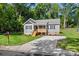 View of the home's front, showing the lawn, driveway, and mailbox of this charming property at 951 Hardin Dr, Shelby, NC 28150