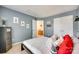 Comfortable bedroom with blue walls, a window, and double closets at 9700 Stewart Spring Ln, Charlotte, NC 28216