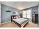 Inviting bedroom with soft blue walls, a window, and neutral carpet at 9700 Stewart Spring Ln, Charlotte, NC 28216