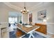 Inviting dining area with a decorative light fixture and seamless flow into the living spaces at 9700 Stewart Spring Ln, Charlotte, NC 28216