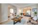 Open-concept living area with arched entryways connecting to the dining room and other living spaces at 9700 Stewart Spring Ln, Charlotte, NC 28216