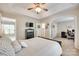 Spacious main bedroom featuring a ceiling fan and access to an office area at 9700 Stewart Spring Ln, Charlotte, NC 28216