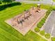 Aerial view of the community playground with swings and play structure at 9700 Stewart Spring Ln, Charlotte, NC 28216