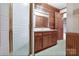 Cozy bathroom with wood paneled walls, glass shower and vanity, creating a relaxing and functional space at 993 Jackson Rd, Fort Lawn, SC 29714
