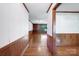 Hallway with hardwood floors connecting multiple rooms in the home at 993 Jackson Rd, Fort Lawn, SC 29714