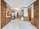 Open-concept area showcasing the kitchen, hallway, and wood-paneled walls that lead to various rooms at 993 Jackson Rd, Fort Lawn, SC 29714