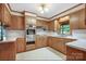 Well-lit kitchen with wood cabinets, stainless steel appliances, and white countertops at 993 Jackson Rd, Fort Lawn, SC 29714