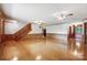 Open living area with stairs and access to kitchen, and decorative glass front door at 993 Jackson Rd, Fort Lawn, SC 29714
