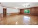 Spacious living room features hardwood floors and wood-paneled accent wall at 993 Jackson Rd, Fort Lawn, SC 29714