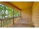 Inviting porch with a swing and views of the lake and mature trees at 993 Jackson Rd, Fort Lawn, SC 29714