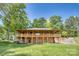 Log cabin with a covered porch and basement at 993 Jackson Rd, Fort Lawn, SC 29714