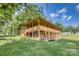 Picturesque log cabin with a covered porch and shaded basement at 993 Jackson Rd, Fort Lawn, SC 29714
