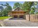Elevated log cabin featuring a covered porch and a convenient basement garage at 993 Jackson Rd, Fort Lawn, SC 29714