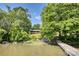 A scenic view of lake and house from the dock, surrounded by lush greenery and trees at 993 Jackson Rd, Fort Lawn, SC 29714