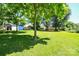 Well-maintained backyard featuring mature trees and a lush lawn, providing ample space at 1004 Midwood Dr, Monroe, NC 28112