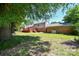 Spacious backyard with a wooden deck and partial view of home's exterior at 1004 Midwood Dr, Monroe, NC 28112