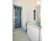 Retro bathroom with turquoise-colored toilet, sink, and blue-tile shower with glass door at 1004 Midwood Dr, Monroe, NC 28112