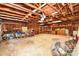 Spacious garage offering ample storage and workspace with exposed ceiling beams at 1004 Midwood Dr, Monroe, NC 28112