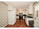 Spacious kitchen with white appliances, green countertops and wallpaper at 1004 Midwood Dr, Monroe, NC 28112