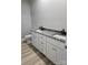 Bathroom with double sink vanity and granite countertops, creating a luxurious space at 107 Skyland Dr, Mount Gilead, NC 27306