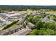 An aerial view of the home and neighborhood showing nearby streets and surrounding greenery at 1161 Stuarts Landing Dr, Cramerton, NC 28032