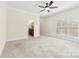 Bedroom featuring neutral carpet, ceiling fan, white trim and adjoining bathroom at 1161 Stuarts Landing Dr, Cramerton, NC 28032