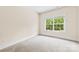 Bright bedroom featuring neutral carpet and window with wooded views at 1161 Stuarts Landing Dr, Cramerton, NC 28032