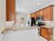 Bright kitchen with granite countertops, stainless steel appliances, and tile flooring with backyard access at 1161 Stuarts Landing Dr, Cramerton, NC 28032