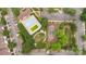 Community aerial view with a swimming pool, tennis court, parking, and lush landscaping at 11707 Ridgeway Park Dr, Charlotte, NC 28277