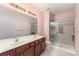 Bathroom features double vanity, large mirror, and glass-enclosed shower at 11707 Ridgeway Park Dr, Charlotte, NC 28277