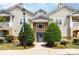 Close up of condominium entrance with well-maintained landscaping and visible signage at 11707 Ridgeway Park Dr, Charlotte, NC 28277
