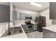 Updated kitchen featuring stainless steel appliances and sleek grey cabinetry at 11707 Ridgeway Park Dr, Charlotte, NC 28277