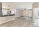Inviting living space with hardwood floors, ceiling fan, and adjacent kitchen at 11707 Ridgeway Park Dr, Charlotte, NC 28277