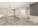 Open-concept living area with hardwood floors and access to a balcony at 11707 Ridgeway Park Dr, Charlotte, NC 28277