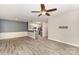 Open concept living space featuring sleek floors, neutral paint, and seamless flow to the kitchen at 11707 Ridgeway Park Dr, Charlotte, NC 28277