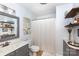 Cozy bathroom with decorative shelves, framed mirror, and modern fixtures at 1184 W Oak Dr, Rock Hill, SC 29732