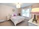 Charming bedroom features a window, chandelier, and whimsical decor at 1184 W Oak Dr, Rock Hill, SC 29732