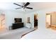 Bright bedroom featuring a ceiling fan, neutral decor, and an en suite bathroom and walk-in closet at 1184 W Oak Dr, Rock Hill, SC 29732