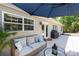 Inviting deck featuring cushioned wicker seating, a grill, and an umbrella for outdoor enjoyment at 1184 W Oak Dr, Rock Hill, SC 29732