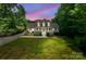 Charming two-story home with a well-manicured lawn, black shutters, and dormer windows at 1184 W Oak Dr, Rock Hill, SC 29732