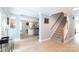 Open foyer with light wood floors and stairwell leading into an open-concept living space at 1184 W Oak Dr, Rock Hill, SC 29732