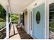 Inviting front porch with seating, stylish front door with oval window and transom at 1184 W Oak Dr, Rock Hill, SC 29732