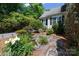Charming front yard with a small pond and rock garden leading to a cozy home at 1184 W Oak Dr, Rock Hill, SC 29732