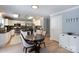 Modern kitchen with white cabinets, stainless steel appliances, and a breakfast nook at 1184 W Oak Dr, Rock Hill, SC 29732