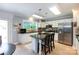 Kitchen includes a center island with bar seating, granite countertops, and stainless steel refrigerator at 1184 W Oak Dr, Rock Hill, SC 29732