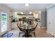 Bright kitchen features white cabinets, stainless steel appliances, and a cozy breakfast nook at 1184 W Oak Dr, Rock Hill, SC 29732