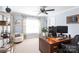 Bright office features a ceiling fan, a large window, and a classic wood desk at 1184 W Oak Dr, Rock Hill, SC 29732
